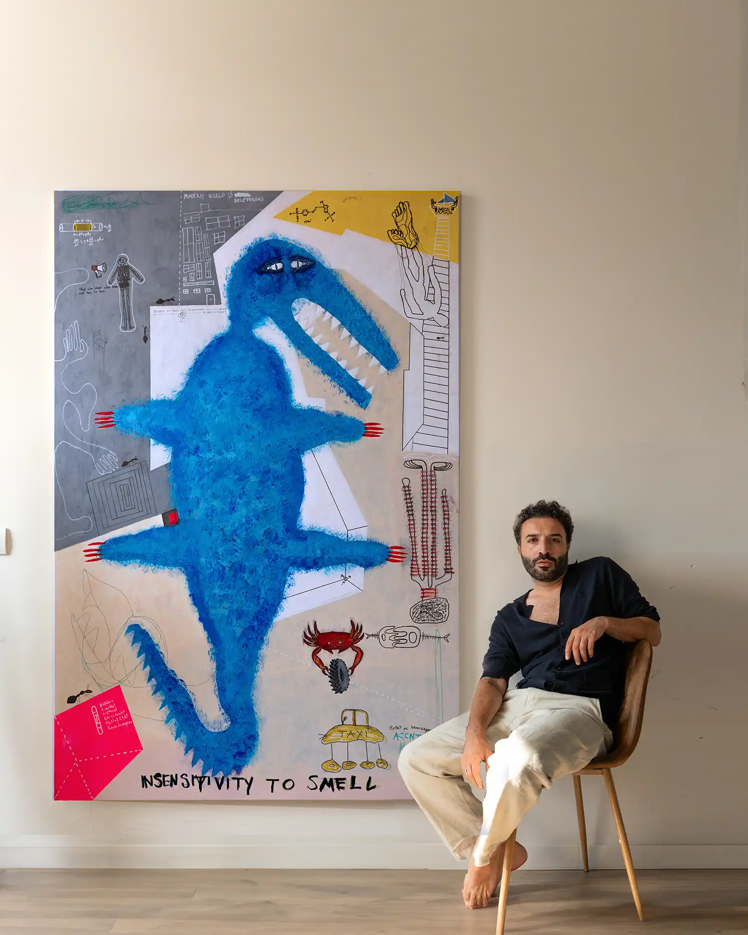 Ümit Sural with artwork in his studio